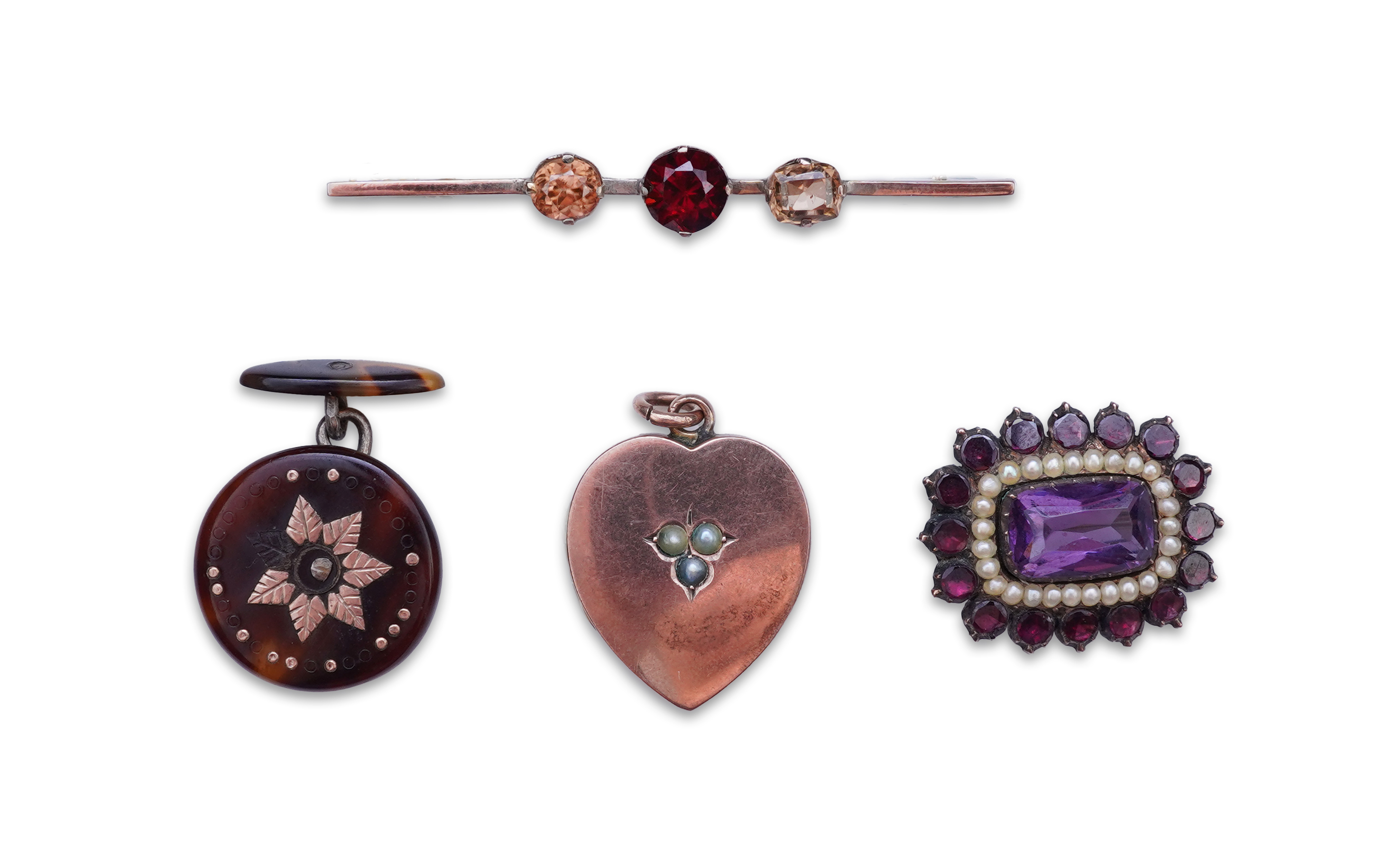 A Victorian yellow metal, amethyst and garnet cluster set brooch, 22mm, an early 20th century yellow metal and seed pearl set heart shaped locket, a yellow metal, garnet and zircon set three stone bar brooch and a tortoi